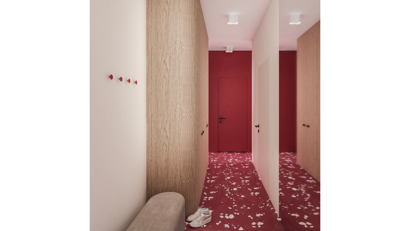 Przedpokój z bordowymi akcentami i zabudową na wymiar w projekcie wnętrza na Koszutce.